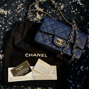 Chanel Navy Classic Caviar quilted Mini Flap Bag with Gold Hardware. New